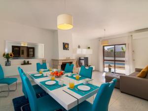 a dining room and living room with a table and chairs at Villa Galé 600m from the beach by Interhome in Patroves