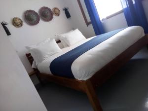 Postel nebo postele na pokoji v ubytování SATRANA HOTEL TAMATAVE