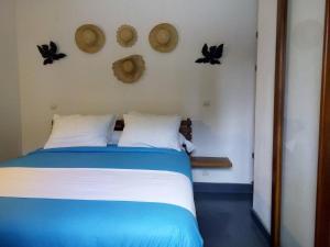 Postel nebo postele na pokoji v ubytování SATRANA HOTEL TAMATAVE