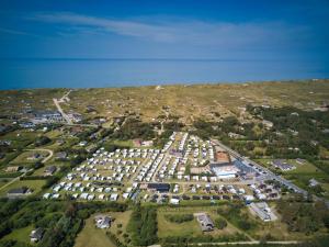 an aerial view of a large parking lot at Vedersø Klit Camping & Cottages in Ulfborg