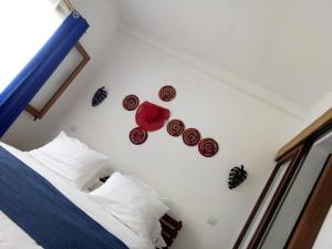 Postel nebo postele na pokoji v ubytování SATRANA HOTEL TAMATAVE