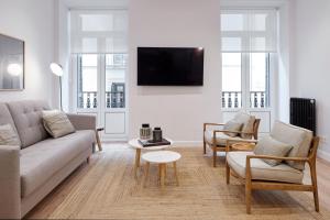 Televízia a/alebo spoločenská miestnosť v ubytovaní Mayor Suite 3 by FeelFree Rentals