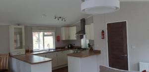 A kitchen or kitchenette at Inverbeg Holiday Park 