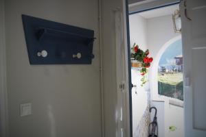 a door with a blue box next to a window at CASA AMABLE in La Roza +45 photos