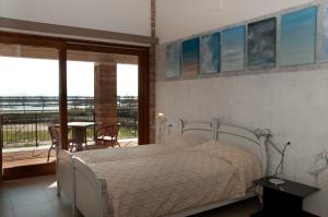 Postel nebo postele na pokoji v ubytování Agriturismo La Barena