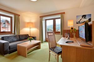 Telewizja i/lub zestaw kina domowego w obiekcie Hotel Reitlwirt