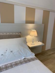 Postel nebo postele na pokoji v ubytování B&B Nonna Teresa