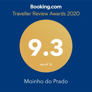 a yellow circle with the number nine and the text travelling review awards at Moinho do Prado in Vila Nova de Cerveira