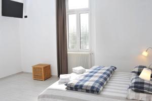 A bed or beds in a room at Guest House La Genesa