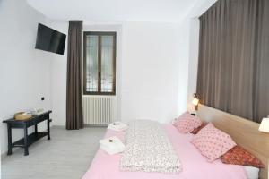 A bed or beds in a room at Guest House La Genesa