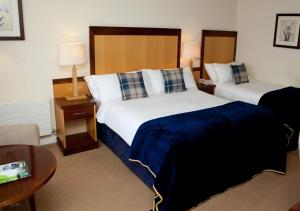 Katil atau katil-katil dalam bilik di Headfort Arms Hotel