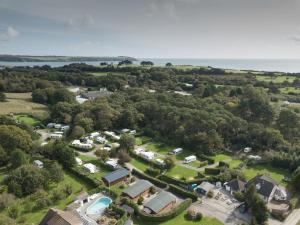 an aerial view of a park with a resort and a lake at East Crinnis Log Cabin in Par