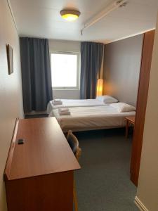 Postel nebo postele na pokoji v ubytování Narvik Budget Rooms + 17 fotografií