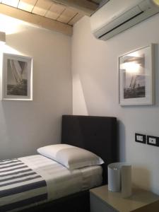 Postel nebo postele na pokoji v ubytování Barbacan Boutique Hotel