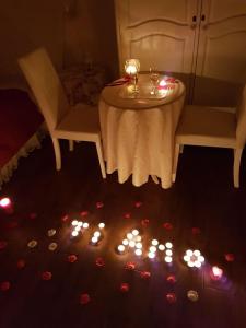 a table and chairs with candles on the floor at Sweet Dreams in La Spezia