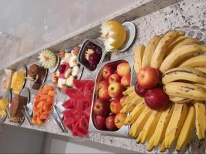 a tray of fruit and vegetables on a table at Nico Palace Hotel in Guanambi