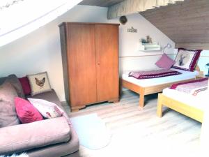 Ένα ή περισσότερα κρεβάτια σε δωμάτιο στο Ferienhaus Baumann
