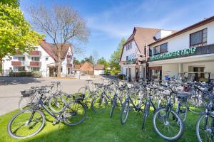 a bunch of bikes parked in front of a building at Ringhotel Warnemünder Hof in Warnemünde