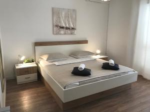 Кровать или кровати в номере Apartment & Rooms Riva