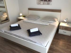 Кровать или кровати в номере Apartment & Rooms Riva