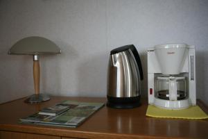 a coffee maker sitting on top of a table at B&B Korendijk in Zuid-Beijerland