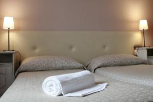 Postel nebo postele na pokoji v ubytování Ankon Hotel