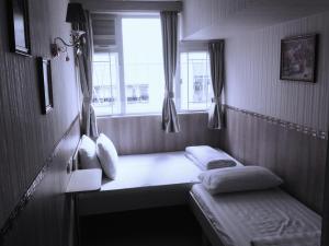 Voodi või voodid majutusasutuse Kowloon YOUTH Village Tsim Sha Tsui 九龙青年公寓 toas