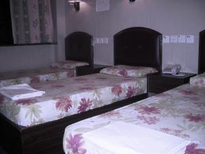 Voodi või voodid majutusasutuse Kowloon YOUTH Village Tsim Sha Tsui 九龙青年公寓 toas