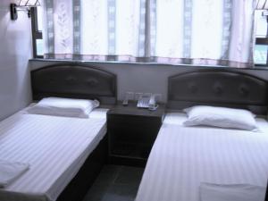 Voodi või voodid majutusasutuse Kowloon YOUTH Village Tsim Sha Tsui 九龙青年公寓 toas