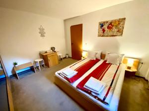 a bedroom with a large bed in a room at Cristi's Rooms - Pensiune in Oradea +53 photos