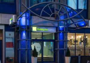 a building with a blue sign in front of it at Holiday Inn Express Bristol City Centre by IHG in Bristol