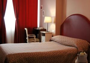 Postel nebo postele na pokoji v ubytování Ankon Hotel