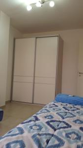 Una cama o camas en una habitación de Departamento amoblado de un dormitorio 43m2