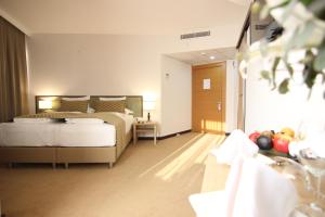 A bed or beds in a room at ATLAS OTELİ