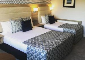 Voodi või voodid majutusasutuse Kiltimagh Park Hotel toas