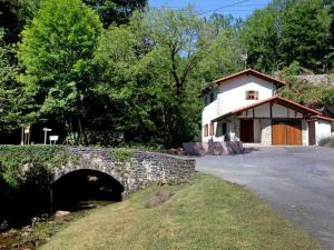 a house with a stone bridge and a building at Holiday Home Uxaneko-errota by Interhome in Bera