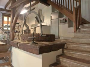 a kitchen with a sink and stairs in a house at Holiday Home Uxaneko-errota by Interhome in Bera