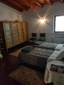 Katil atau katil-katil dalam bilik di Ca' d'La Tonilla