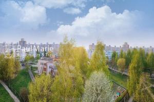 a view of a city with buildings and trees at PaulMarie Apartments on Shahterov in Salihorsk