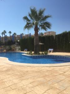 The swimming pool at or close to First Line Cabo Roig Orihuela Costa
