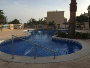 The swimming pool at or close to First Line Cabo Roig Orihuela Costa