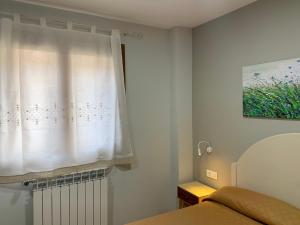 Ein Bett oder Betten in einem Zimmer der Unterkunft Apartamentos Maladeta