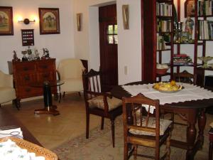 a living room filled with furniture and a table at Quinta Do Cano in Évora