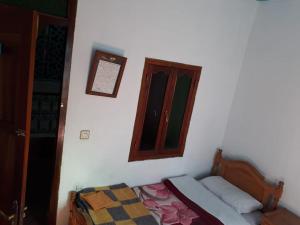 Postel nebo postele na pokoji v ubytování Harmony Hotel