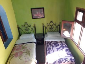 Postel nebo postele na pokoji v ubytování Harmony Hotel