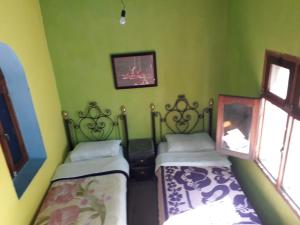 Postel nebo postele na pokoji v ubytování Harmony Hotel