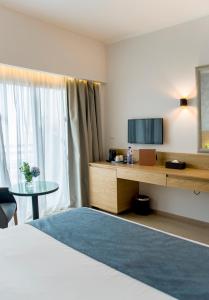 Телевизор и/или развлекательный центр в Ajax Hotel