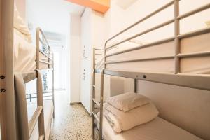 a row of bunk beds in a room at Safestay Athens in Athens