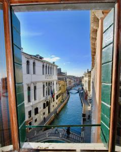 a view of a canal from a window at CA GRIMANI stunning view and comfort in Venice