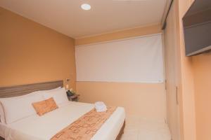 TV a/nebo společenská místnost v ubytování Hotel Aixo Suites By GEH Suites